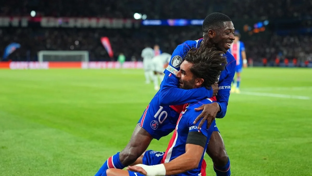 Ousmane Dembele and Ferran Torres celebrate.